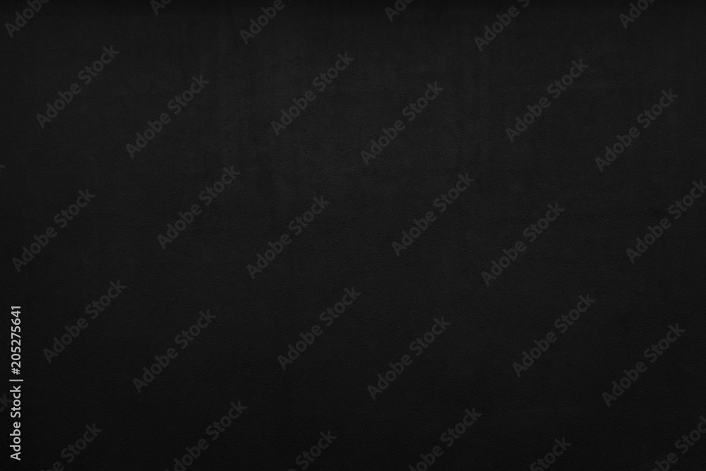 Cement or plaster wall. Black background. Cement or plaster wall. Black background.