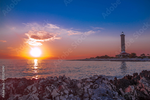 Lighthouse at sunset sea beach sun summer