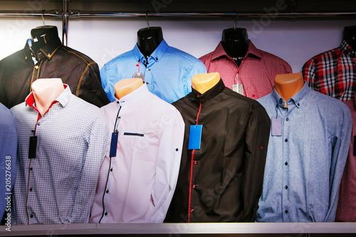  Advertising for shop men's clothing. Showcase with men's shirts on mannequins_