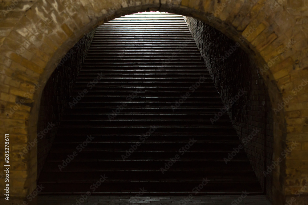 Staircase in ancient fortress with dramatic light