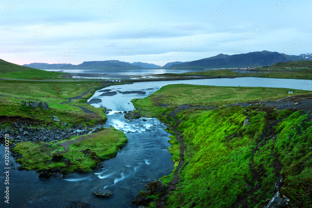 Typical Iceland landscape with mountains and river in summer time