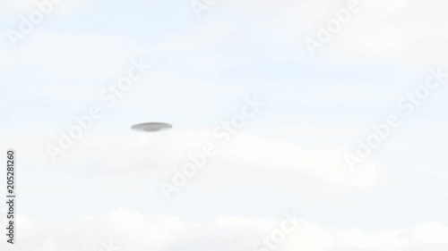 UFO sighting, Flying saucer hovering over a town, metallic reflective aircraft rotating and moving, realistic reconstruction of real UFO sighting, clear fall day with white clouds.