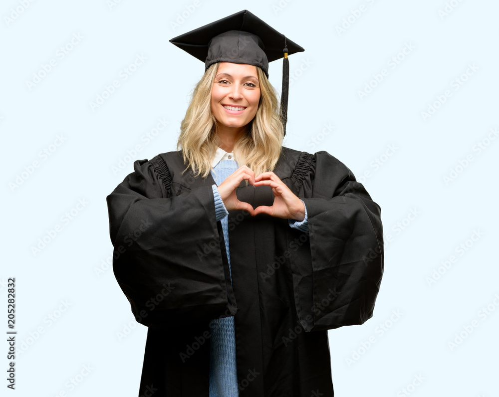 Young graduate woman happy showing love with hands in heart shape expressing healthy and marriage symbol Young graduate woman happy showing love with hands in heart shape expressing healthy and marriage symbol