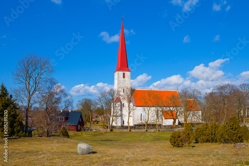 Medieval Lutheran church Kihelkonna, Saaremaa, Estonia. Spring sunny day. Landscape view. photo