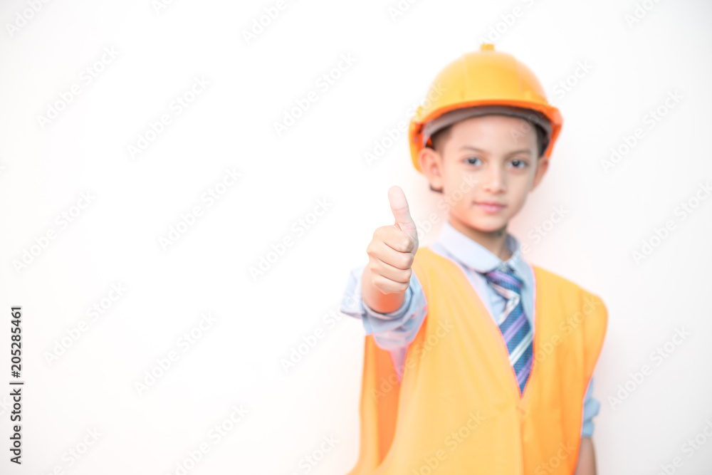 Young boy engineer isolated in white. Handsome early teenage boy portrait with engineering cloth. Confident look pose. Young boy engineer isolated in white. Handsome early teenage boy portrait with engineering cloth. Confident look pose.
