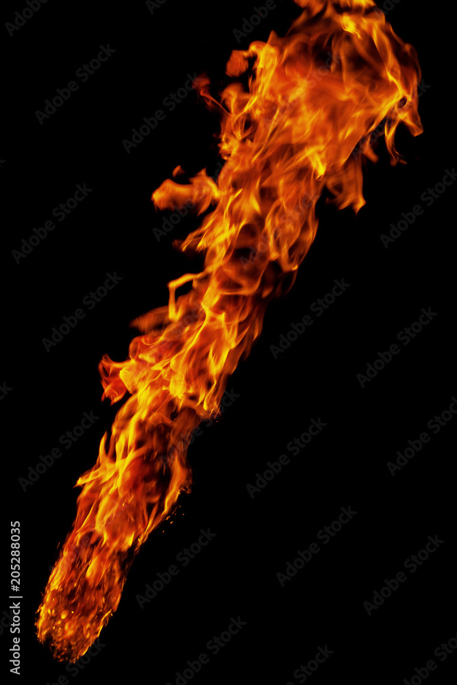 Fire, flame on a black background. Fire for advertising. An unusual game of bright red and yellow colors.