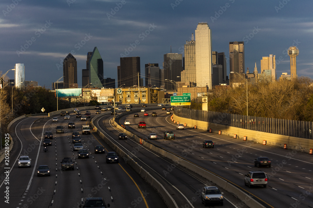 MARCH 5, 2018, DALLAS SKYLINE TEXAS, and Tom Landry Freeway, with streaked lights on Interstate 30 at night
