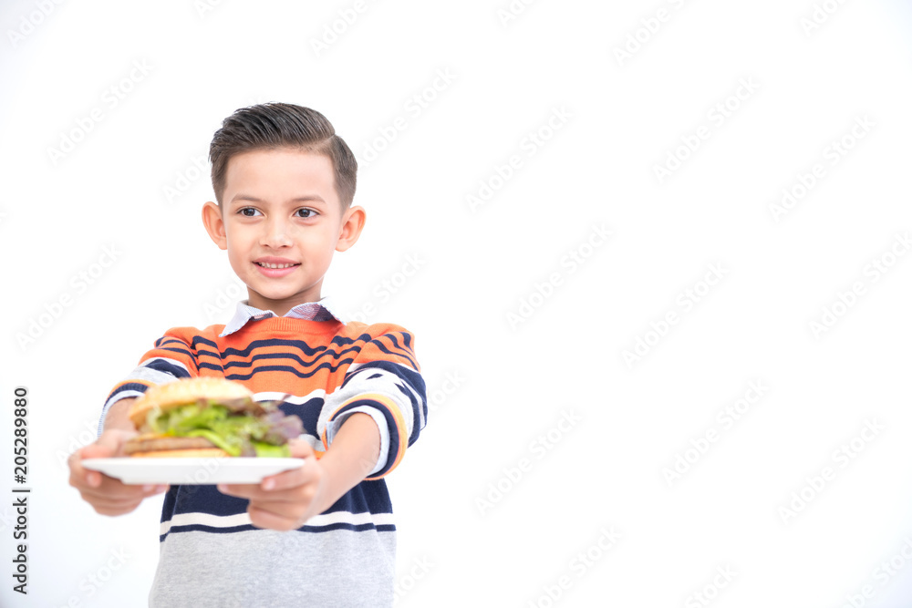 Young boy with burger isolated in white. Handsome early teenage boy portrait. Holding a burger. Happy smile face. Young boy with burger isolated in white. Handsome early teenage boy portrait. Holding a burger. Happy smile face.