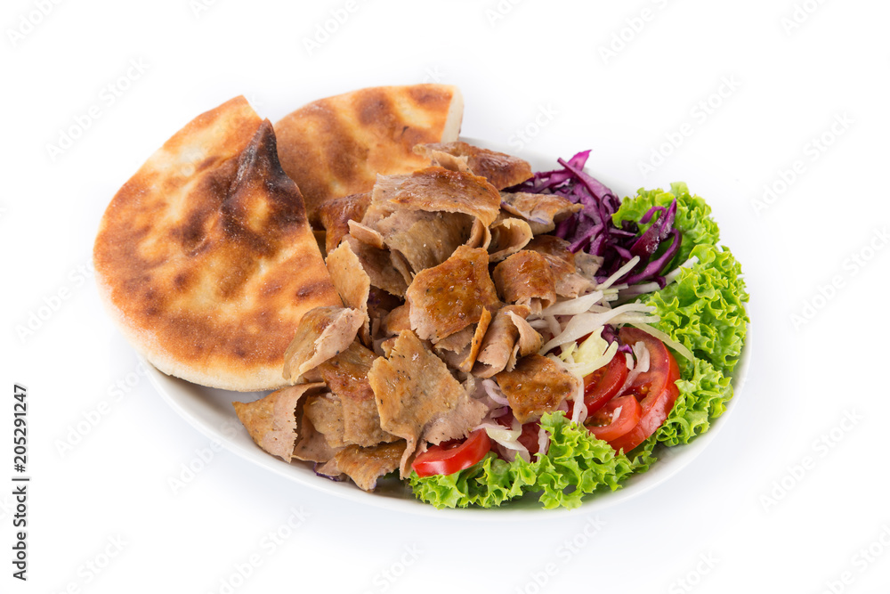 Turkish Doner Kebab plate on white background. StockFoto Adobe Stock