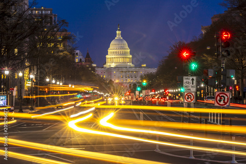 Fototapeta Naklejka Na Ścianę i Meble -  APRIL 11, 2018 WASHINGTON D.C. - Pennsylvania Ave to US Capitol with.Streaked lights going towards US Capitol in Washington DC. during rush hour PM