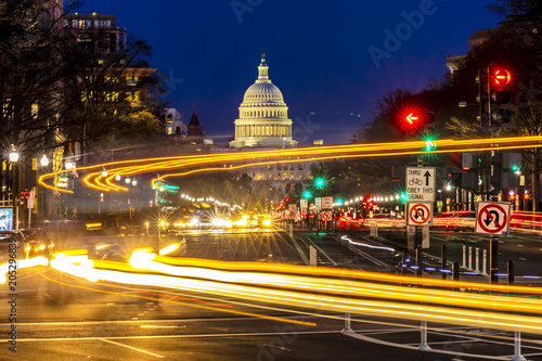 APRIL 11, 2018 WASHINGTON D.C. - Pennsylvania Ave to US Capitol with.Streaked lights going towards US Capitol in Washington DC. during rush hour PM photo