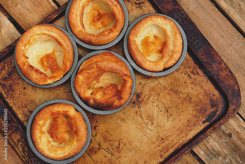 Freshly cooked Yorkshire Puddings for a Sunday roast dinner. British, English cuisine.