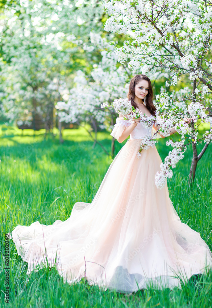 Bride in a wedding dress in the garden