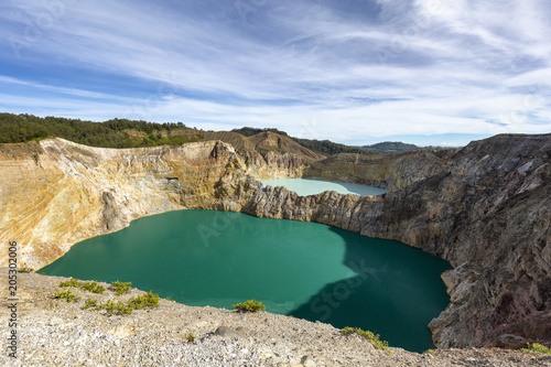 View of the two of the three tri-colored lakes on the peak of Ganung Kelimutu National Park in Flores, Indonesia. photo