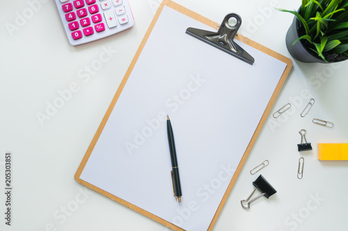 Top view of modern work space office desk table with computer , pen and copy space