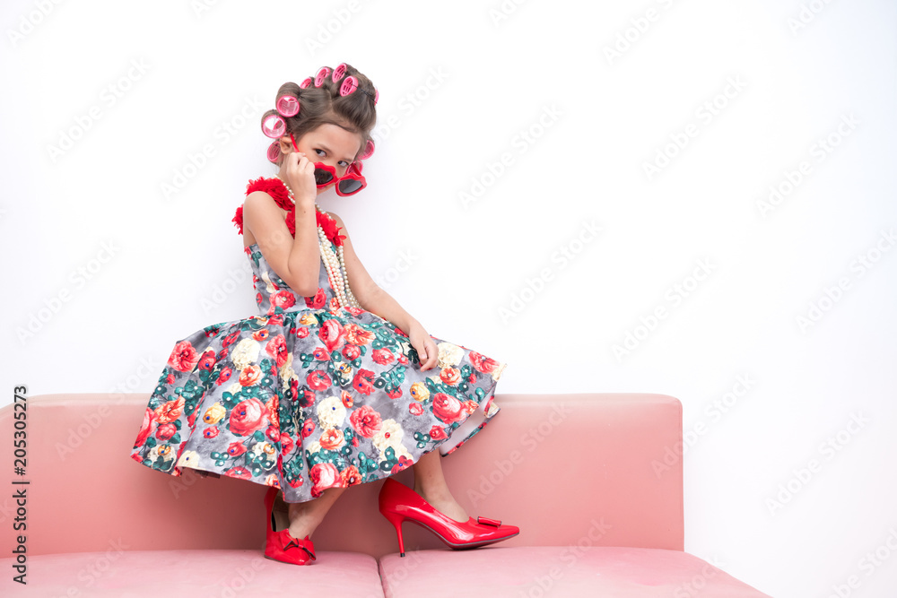 Young super model girl portrait. Pre teen girl dress up like a super model  portrait. High heel red shoes, red sunglasses. Confident pose. Stock Photo  | Adobe Stock