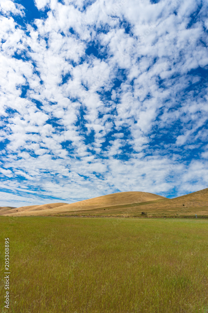 Fototapeta premium Picturesque landscape of vast hills and sky