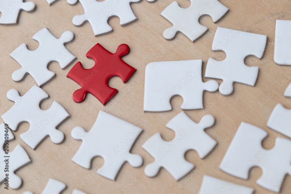 close up of puzzle pieces on table, business and connection concept close up of puzzle pieces on table, business and connection concept