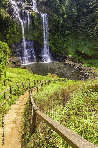 Beautiful view of waterfall landscape. Small waterfall in deep green forest scenery