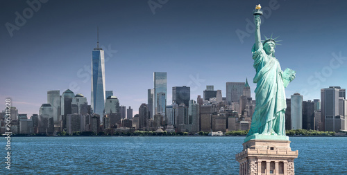 The Statue of Liberty with high-rise building in Lower Manhattan background, Landmarks of New York City, USA © spyarm