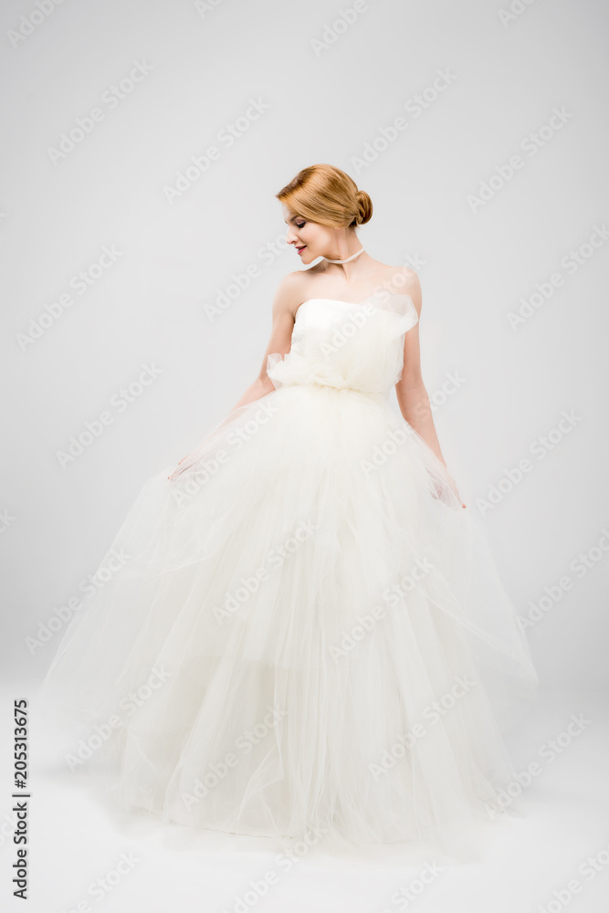 beautiful bride posing in white wedding dress, isolated on grey beautiful bride posing in white wedding dress, isolated on grey