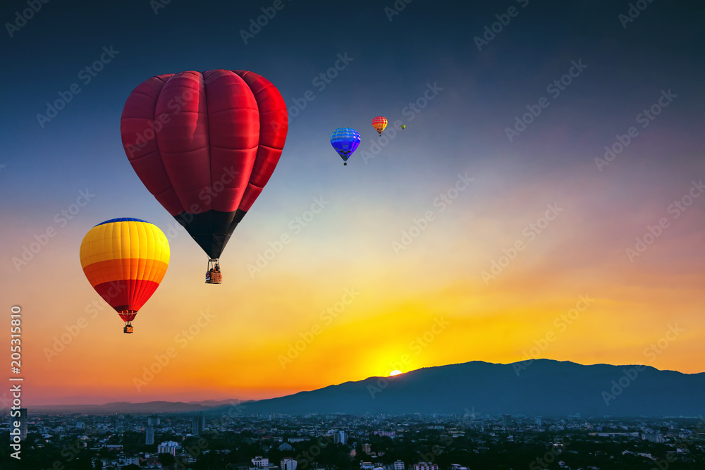 Fototapeta premium Aerial view colorful hot air balloons flying over Chiang Mai city in sunset ,Thailand..