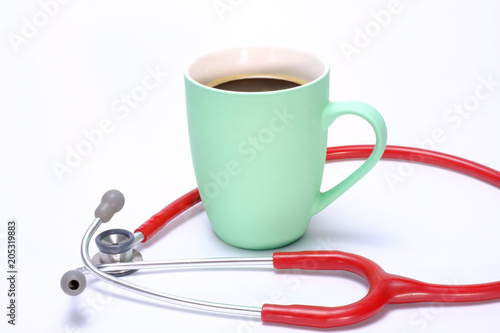 a green coffee mug and a stethoscope photo