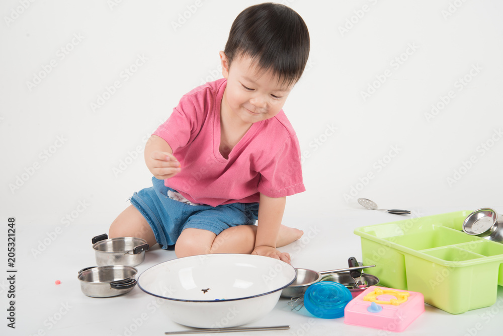 Little Asian toddler 2 years old playing kitchen toy Little Asian toddler 2 years old playing kitchen toy