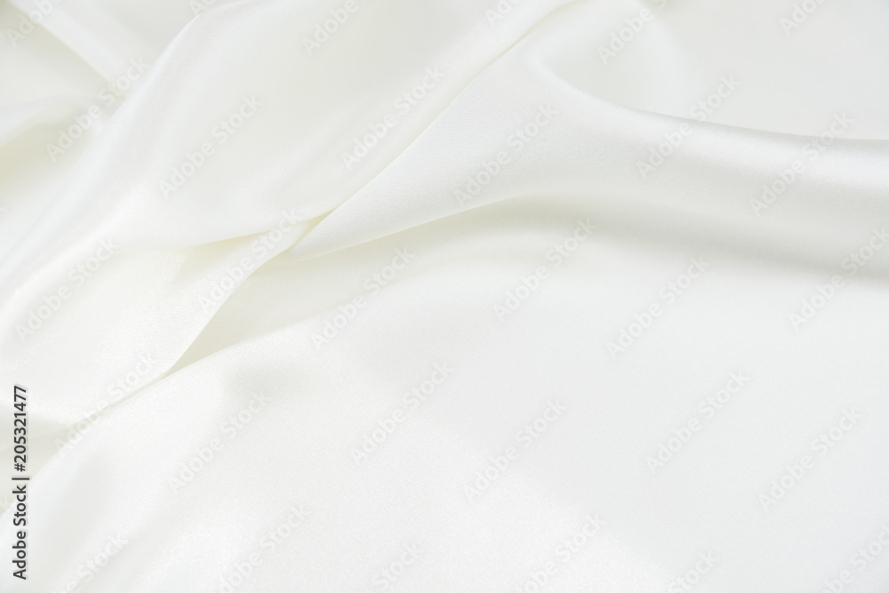 The texture of the satin fabric of white color for the background  