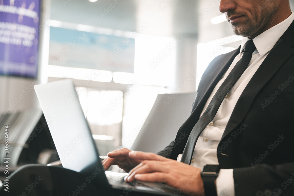 Cropped image of businessman dressed in suit Cropped image of businessman dressed in suit