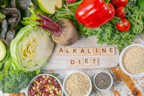 Alkaline diet concept - fresh foods on rustic background photo