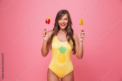 Portrait of a smiling young woman dressed in swimsuit