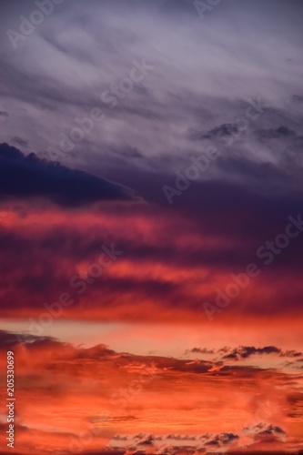 romantic sunset with clouds as background