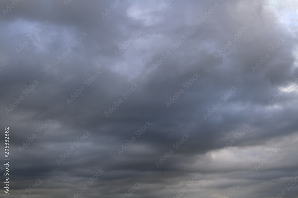 Background of  dramatic sky with dark  clouds. Sky  before a thunder-storm.