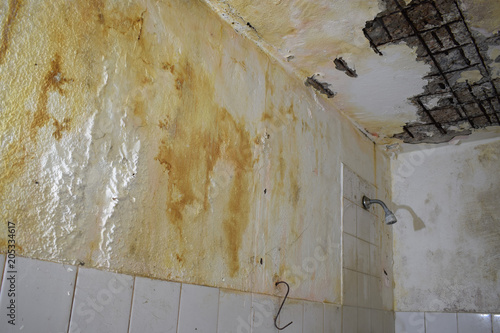 repair in the old house, old broken walls and the ceiling in the toilet