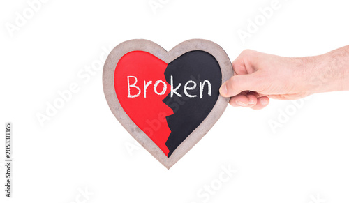 Adult holding heart shaped chalkboard - Broken