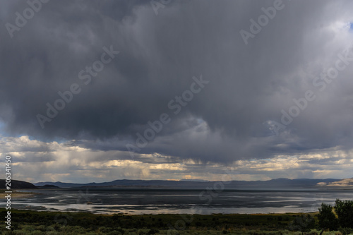 Threatening skies over mono lake, California, as an early evening thunderstorm is rolling in. Image from an early August late afternoon, near Lee Vining, California.