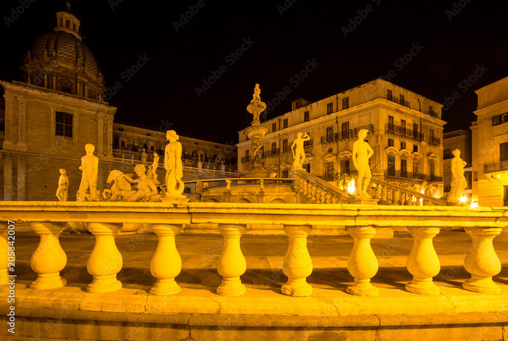 Fountain of shame on  Piazza Pretoria at night, Palermo, Italy