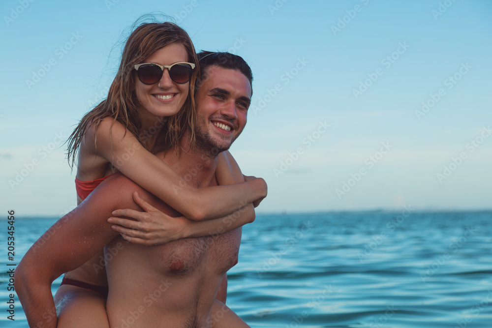 Fototapeta premium Couple having fun on the beach. Summer concept.