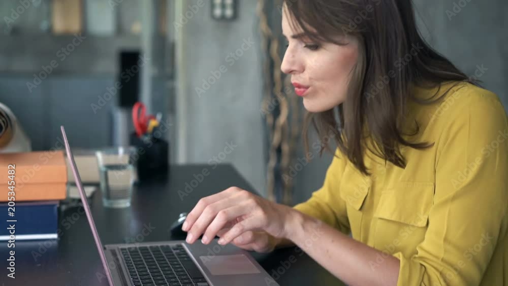 Sad, unhappy businesswoman with laptop sitting by table at home office
Sad, unhappy businesswoman with laptop sitting by table at home office
