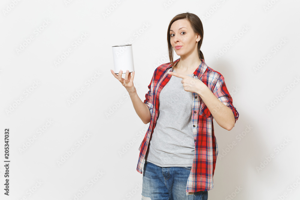 Young beautiful woman in casual clothes pointing index finger on empty paint tin can with copyspace isolated on white background. Instruments, tools for renovation apartment room. Repair home concept. Young beautiful woman in casual clothes pointing index finger on empty paint tin can with copyspace isolated on white background. Instruments, tools for renovation apartment room. Repair home concept.