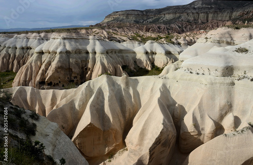 Sunset in a beautiful unique Pink Valley,geological rock formations in Cappadocia, Turkey photo