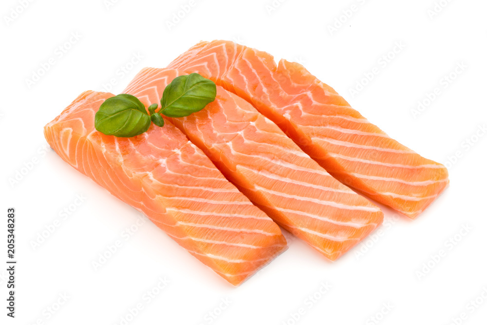 Fresh salmon fillet with basil on the white background. Fresh salmon fillet with basil on the white background.