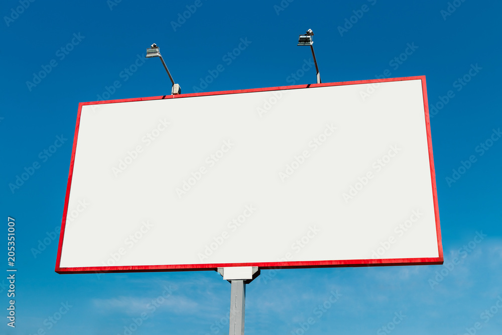 Billboard, billboard, canvas billboard, layout against the blue sky. The concept of outdoor advertising, marketing, sales. mockup Billboard, billboard, canvas billboard, layout against the blue sky. The concept of outdoor advertising, marketing, sales. mockup