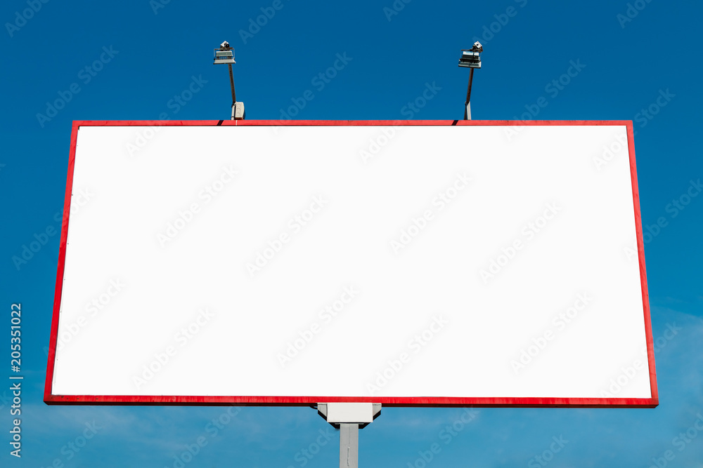 Billboard, billboard, canvas billboard, layout against the blue sky. The concept of outdoor advertising, marketing, sales. mockup Billboard, billboard, canvas billboard, layout against the blue sky. The concept of outdoor advertising, marketing, sales. mockup