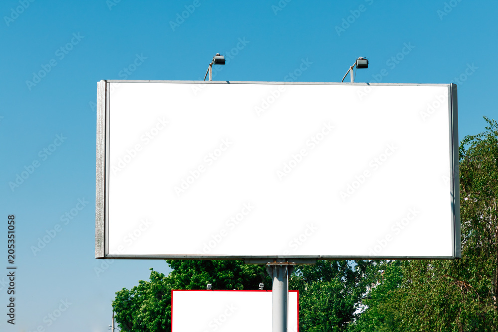 Billboard, billboard, canvas billboard, layout against the blue sky. The concept of outdoor advertising, marketing, sales. mockup Billboard, billboard, canvas billboard, layout against the blue sky. The concept of outdoor advertising, marketing, sales. mockup