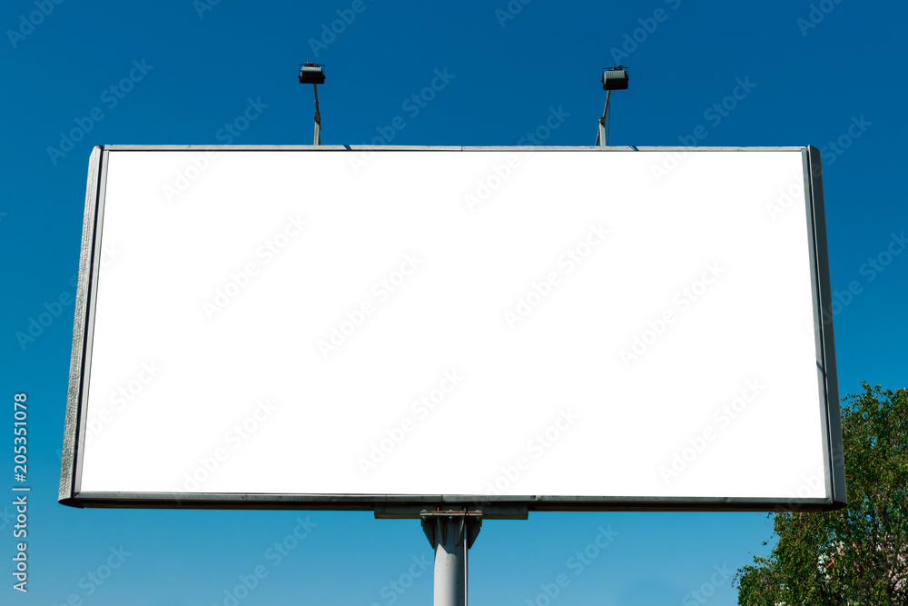 Billboard, billboard, canvas billboard, layout against the blue sky. The concept of outdoor advertising, marketing, sales. mockup Billboard, billboard, canvas billboard, layout against the blue sky. The concept of outdoor advertising, marketing, sales. mockup