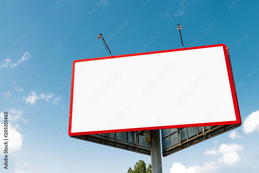 Billboard, billboard, canvas billboard, layout against the blue sky. The concept of outdoor advertising, marketing, sales. mockup Billboard, billboard, canvas billboard, layout against the blue sky. The concept of outdoor advertising, marketing, sales. mockup