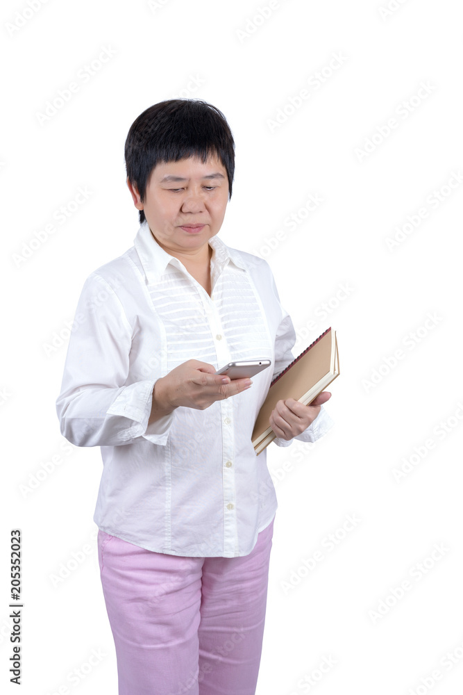 Asian Middle-aged woman holding books and using mobile phone isolated on white background