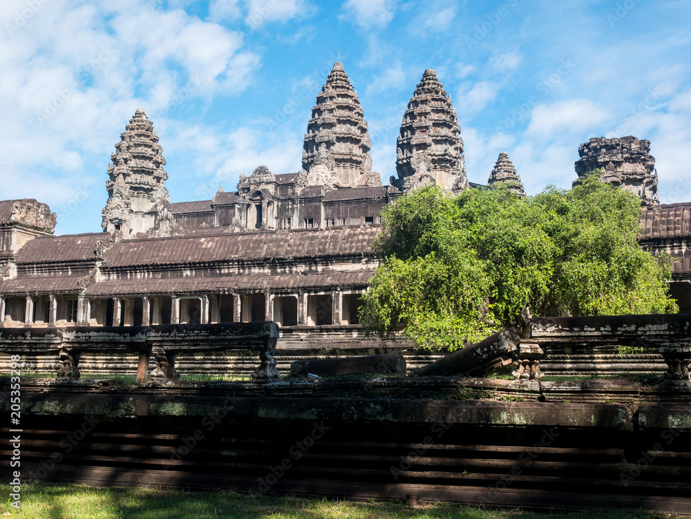 Temple Angkor Wat with blue sky and a tree in Cambodia Temple Angkor Wat with blue sky and a tree in Cambodia